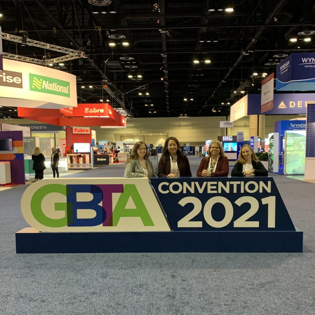 FerskTech Team standing behind a GBTA Convention 2021 sign inside convention center